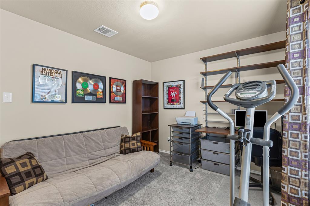 1104 Ruby Court Princeton, TX 75407 - Photo 27 of 40 a living room with furniture a air conditioner and a window