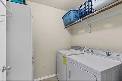 a view of a livingroom with furniture and window