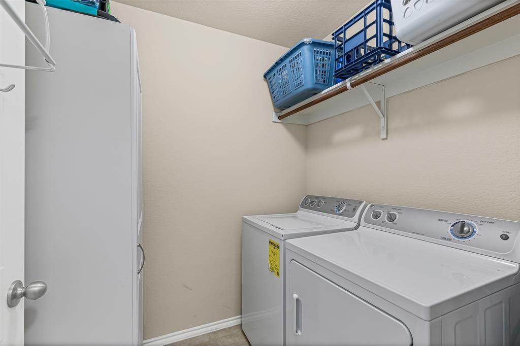 1104 Ruby Court Princeton, TX 75407 - Photo 28 of 40 a utility room with dryer and washer