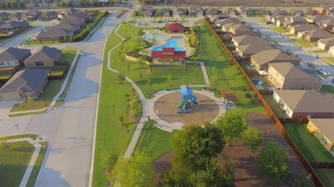 a bedroom with a large bed and a tv