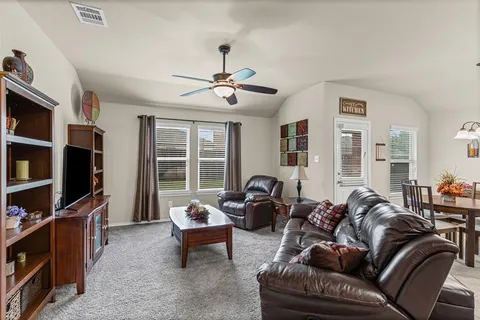 a kitchen with granite countertop kitchen island cabinets and wooden floor