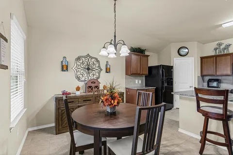 a kitchen with stainless steel appliances granite countertop a stove and a refrigerator