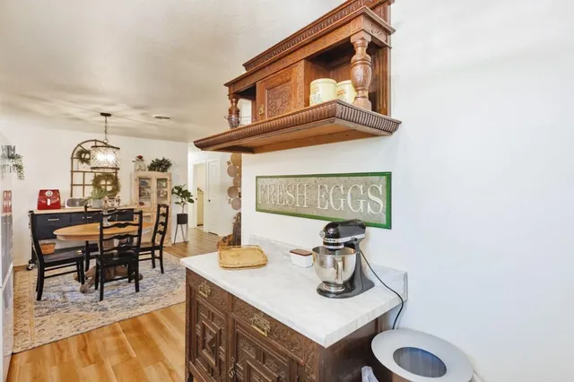 a view of a livingroom with furniture and a table