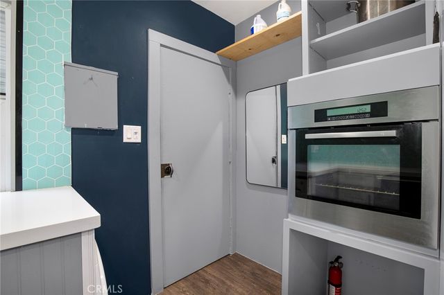 a kitchen with a microwave and a stove