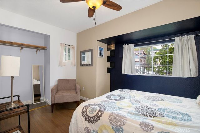 a bedroom with bed and window