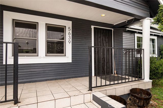 a view of a door of a house with a small porch