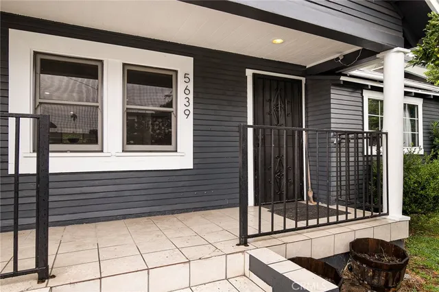 a view of a door of a house with a small porch