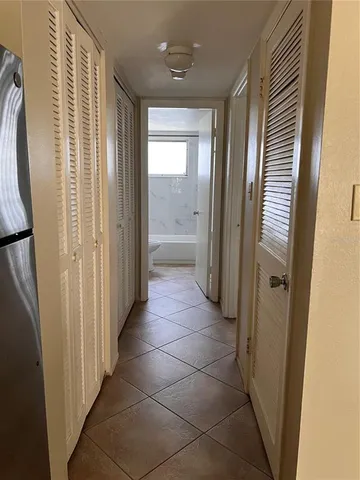 a bathroom with a glass door shower and a sink