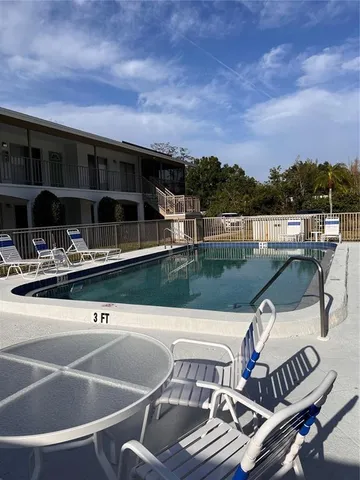 a terrace with outdoor seating and city view
