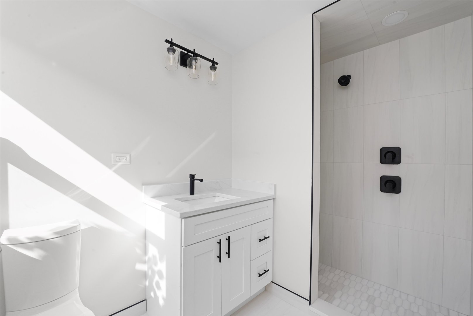 5809 Huron Street Berkeley, IL 60163 - Photo 12 of 26 a bathroom with a sink a toilet and shower