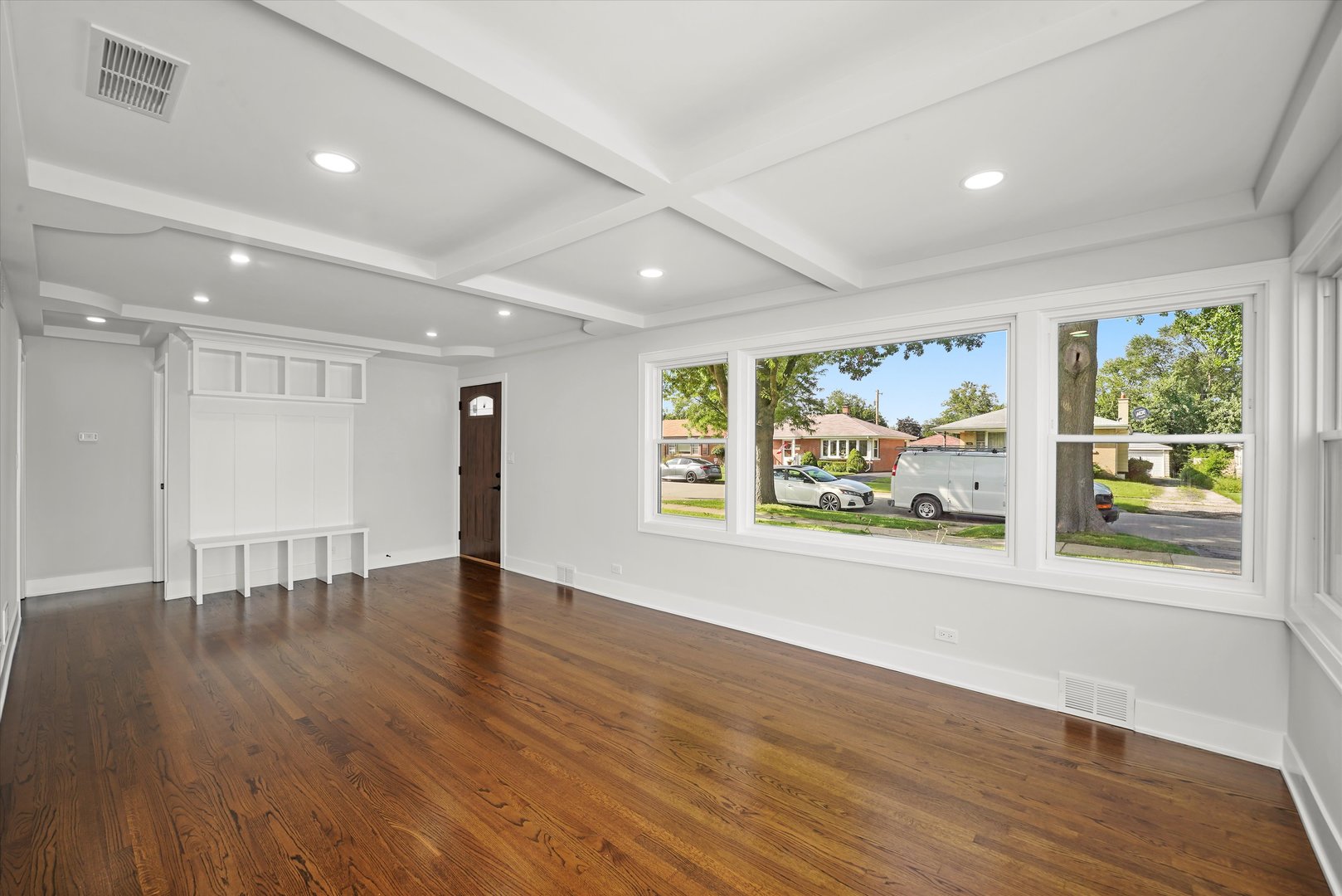 5809 Huron Street Berkeley, IL 60163 - Photo 4 of 26 a view of an empty room with wooden floor and a window