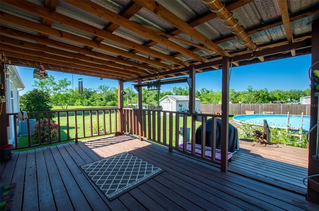 1317 Southwest Martha Street Arcadia, FL 34266 - Photo 15 of 25 a balcony with wooden floor