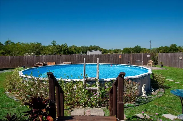 a view of a garden with chairs