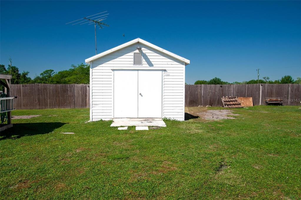 1317 Southwest Martha Street Arcadia, FL 34266 - Photo 20 of 25 a front view of a house with garden