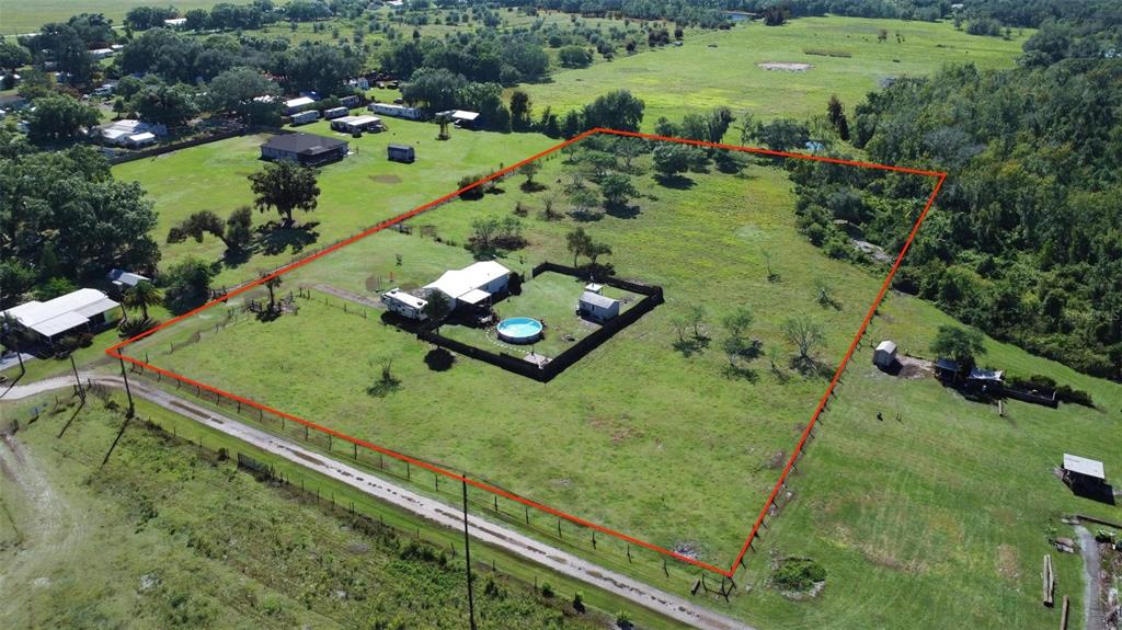 1317 Southwest Martha Street Arcadia, FL 34266 - Photo 24 of 25 an aerial view of a golf course with parking space