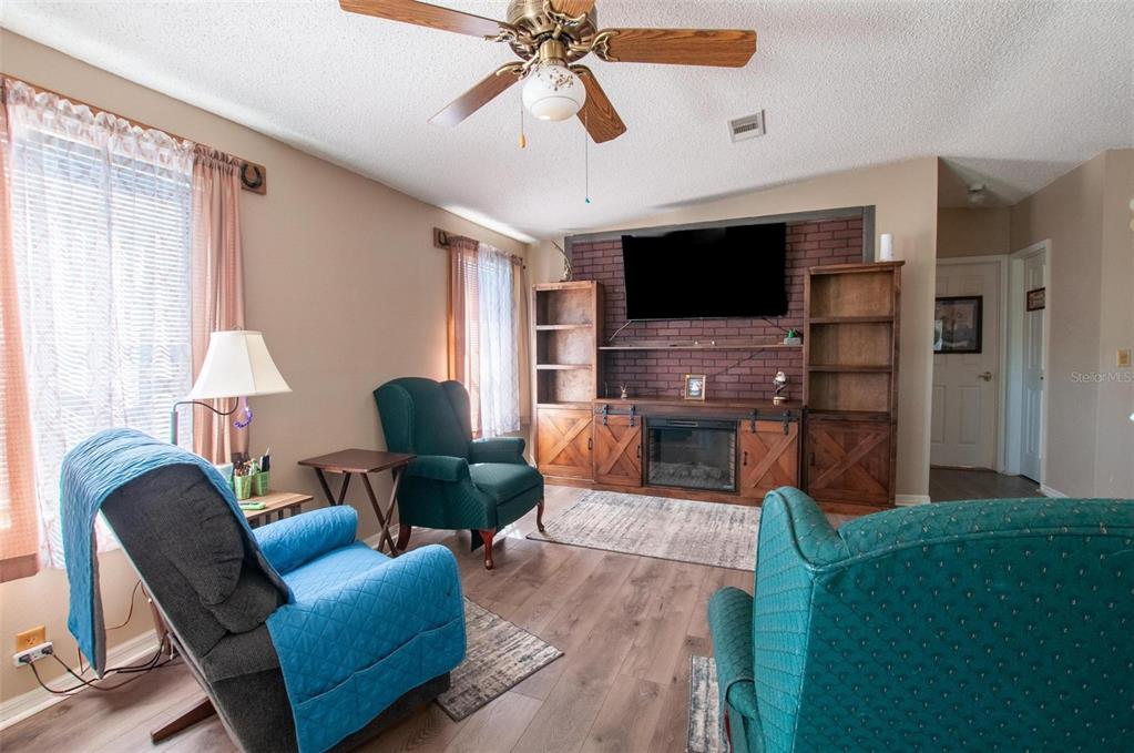 1317 Southwest Martha Street Arcadia, FL 34266 - Photo 4 of 25 a living room with furniture and a flat screen tv