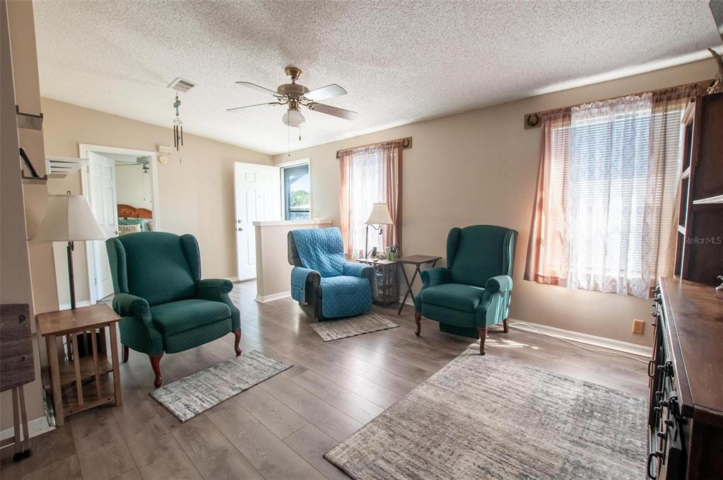 1317 Southwest Martha Street Arcadia, FL 34266 - Photo 6 of 25 a living room with furniture and a large window