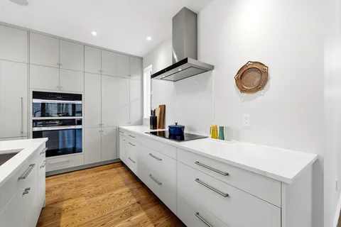 a kitchen with cabinets and appliances