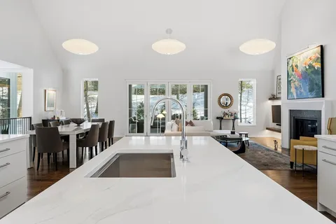 a view of a living room and dining room