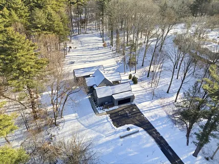 a view of a backyard with sitting area