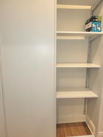 a bathroom with a sink a toilet and a window