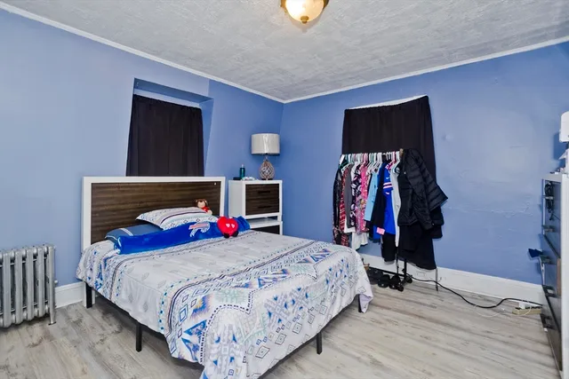 a bedroom with a bed and furniture