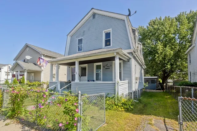 front view of a house with a yard
