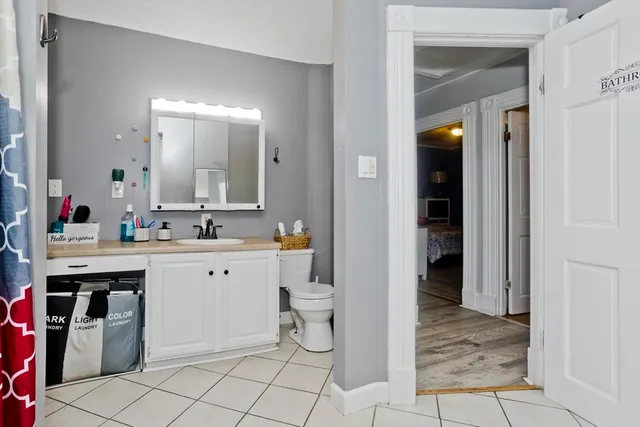 a bathroom with a sink a vanity and a mirror