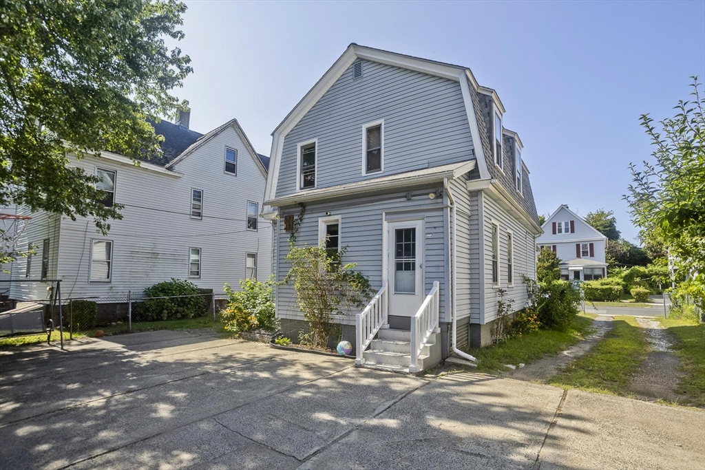 37 Phoenix Street Springfield, MA 01104 - Photo 32 of 39 a front view of a house with garden