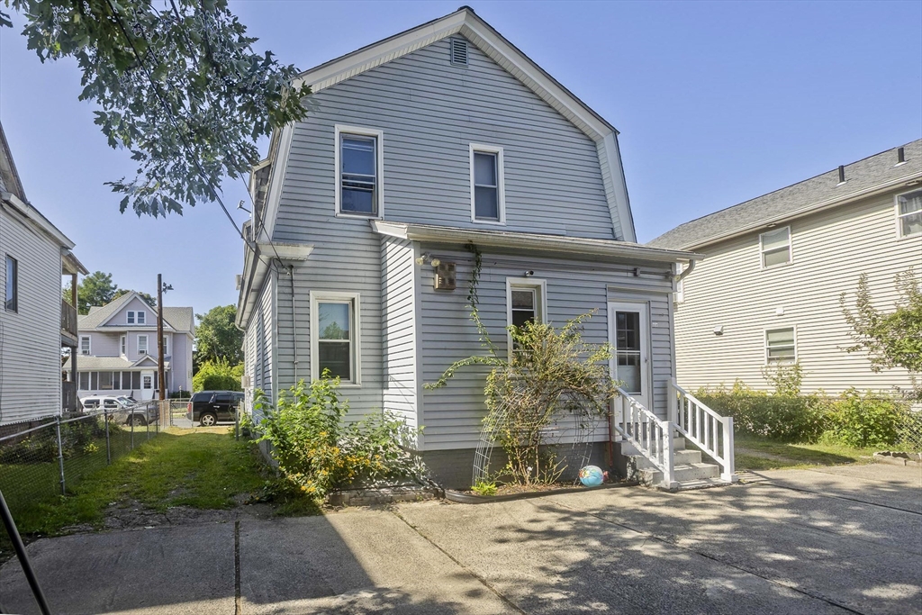 37 Phoenix Street Springfield, MA 01104 - Photo 33 of 39 a front view of a house with garden