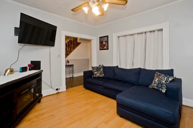 a living room with furniture and a flat screen tv