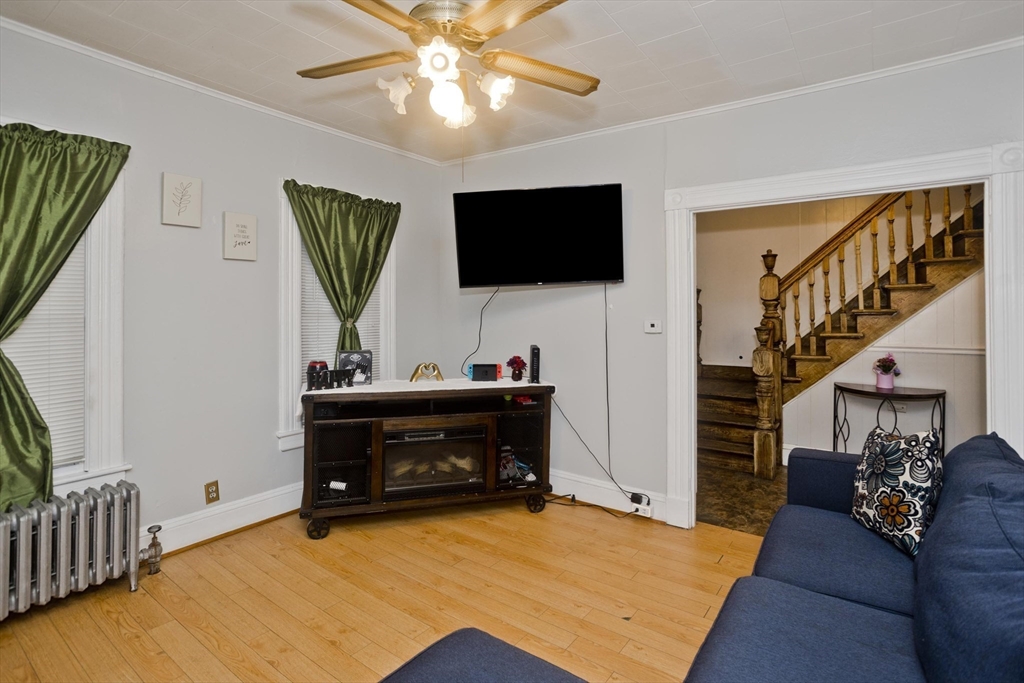 37 Phoenix Street Springfield, MA 01104 - Photo 5 of 39 a living room with furniture and a flat screen tv