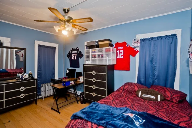 a bedroom with a bed and a dresser