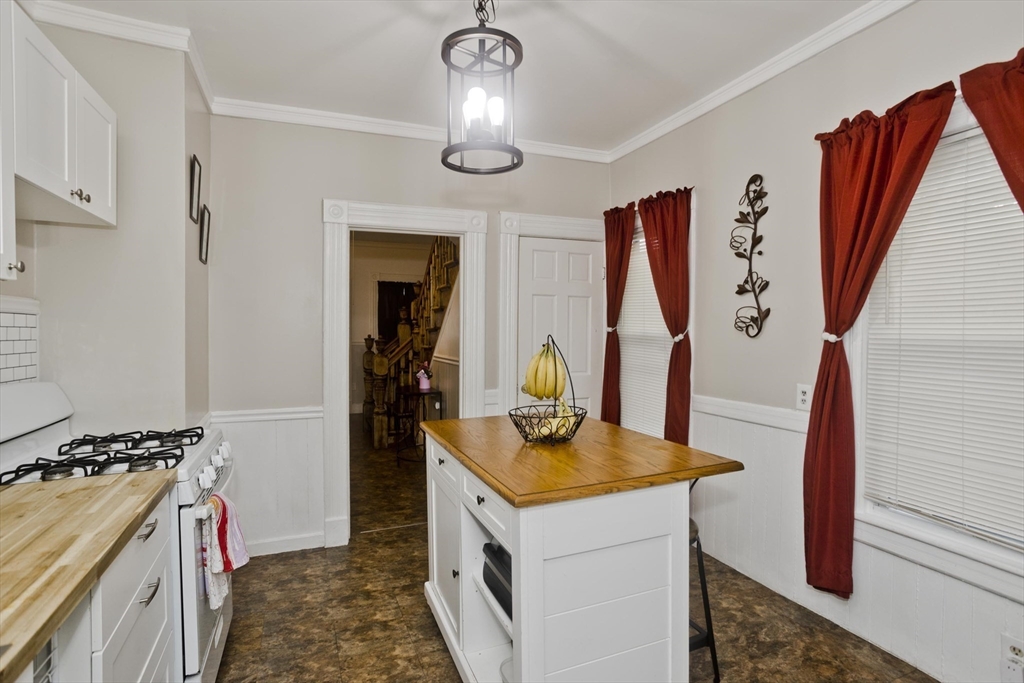 37 Phoenix Street Springfield, MA 01104 - Photo 10 of 39 a kitchen with stainless steel appliances granite countertop a sink stove and refrigerator