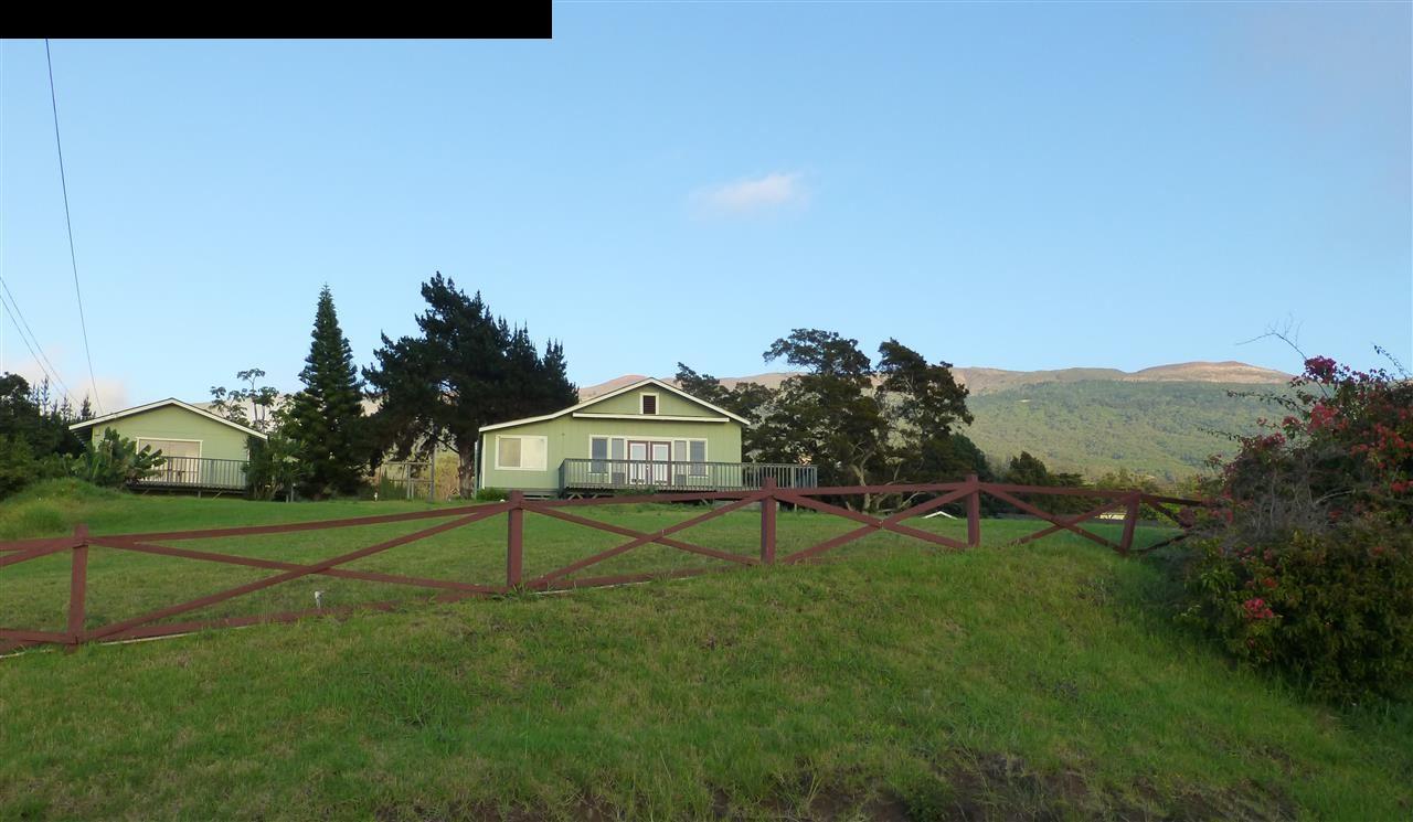 5821 Lower Kula Road Kula, HI 96790 - Photo 1 of 27 a view of a playground with a house