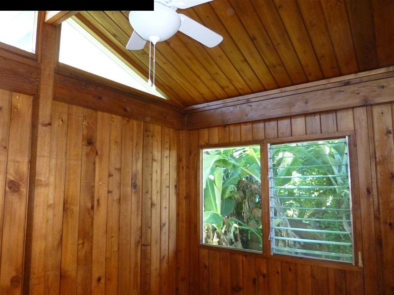 5821 Lower Kula Road Kula, HI 96790 - Photo 15 of 27 a room with a bed and a window