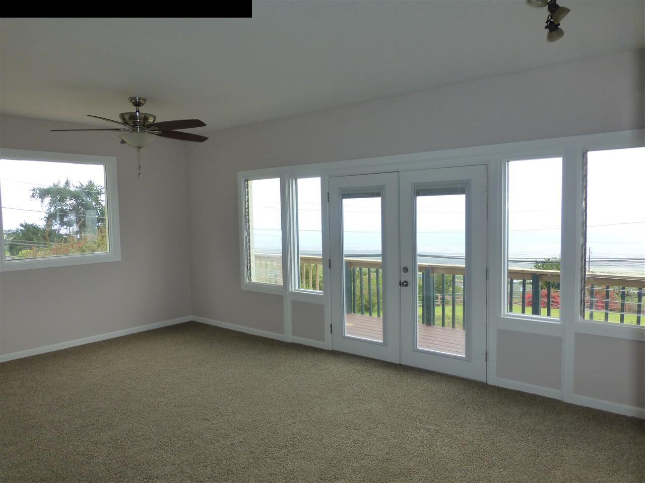 5821 Lower Kula Road Kula, HI 96790 - Photo 5 of 27 a view of room with a ceiling fan and window