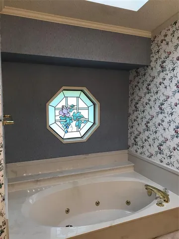 a bathroom with a bathtub and a sink