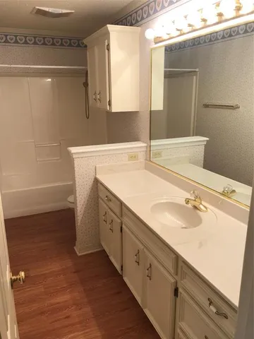 a bathroom with a sink and a mirror