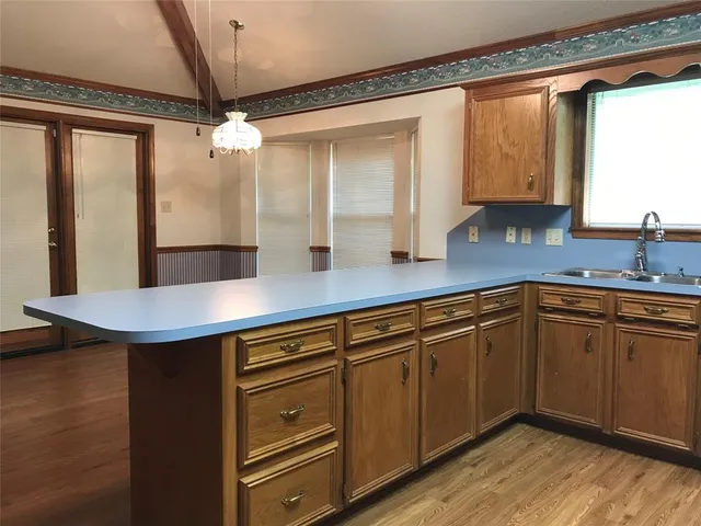 a kitchen with a sink and cabinets
