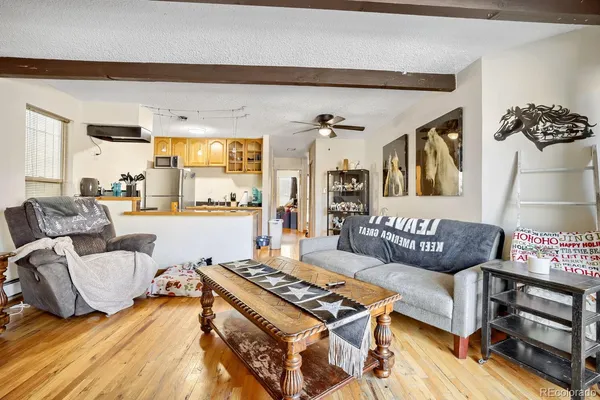 a living room with furniture and a table