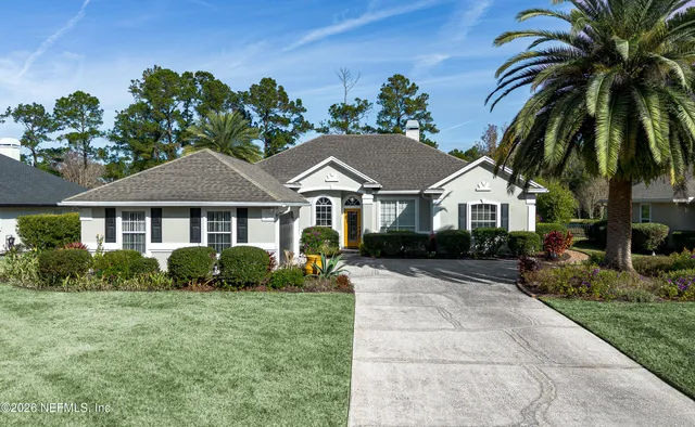 a living room with fireplace furniture and a wooden floor