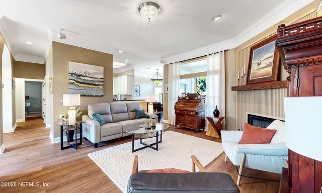 a spacious bathroom with a tub sink and mirror