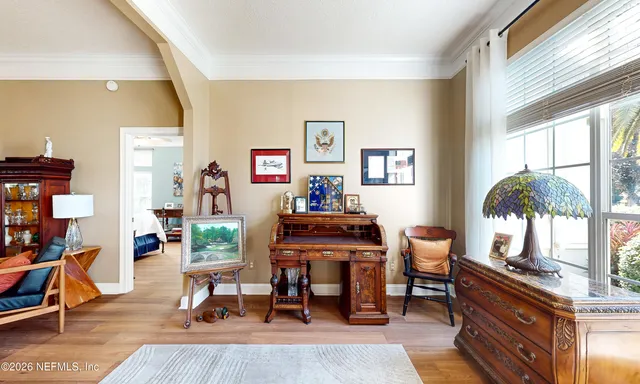 a bathroom with a sink mirror and a large window