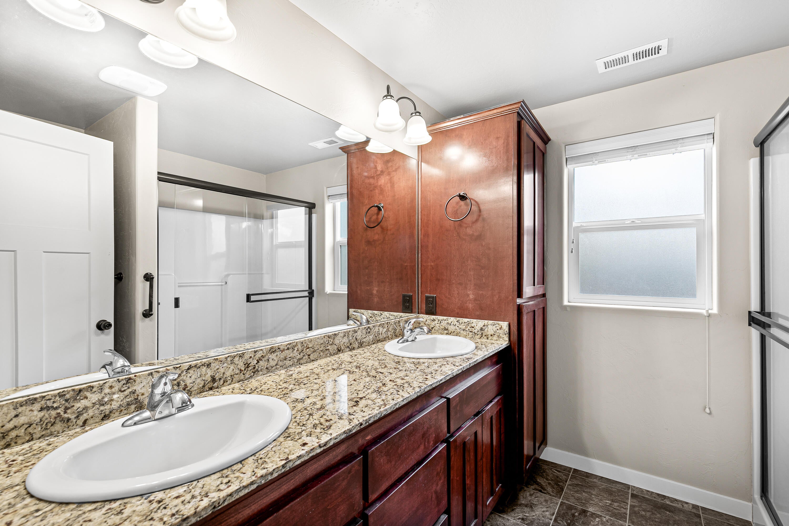 3288 Grant Road Central Point, OR 97502 - Photo 13 of 30 Primary Bathroom features dual sinks, and large shower.