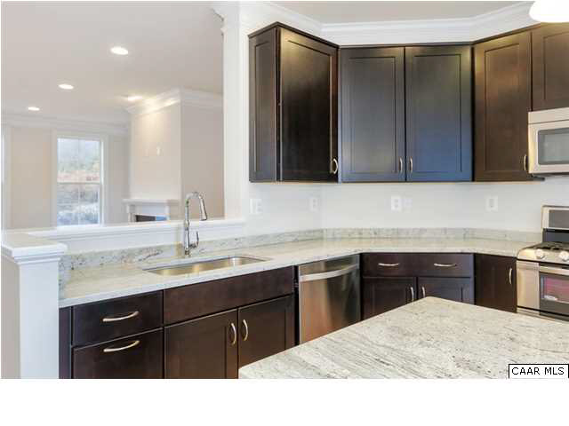 2315 Avinity Loop Charlottesville, VA 22902 - Photo 13 of 23 a kitchen with a sink and a wooden cabinets