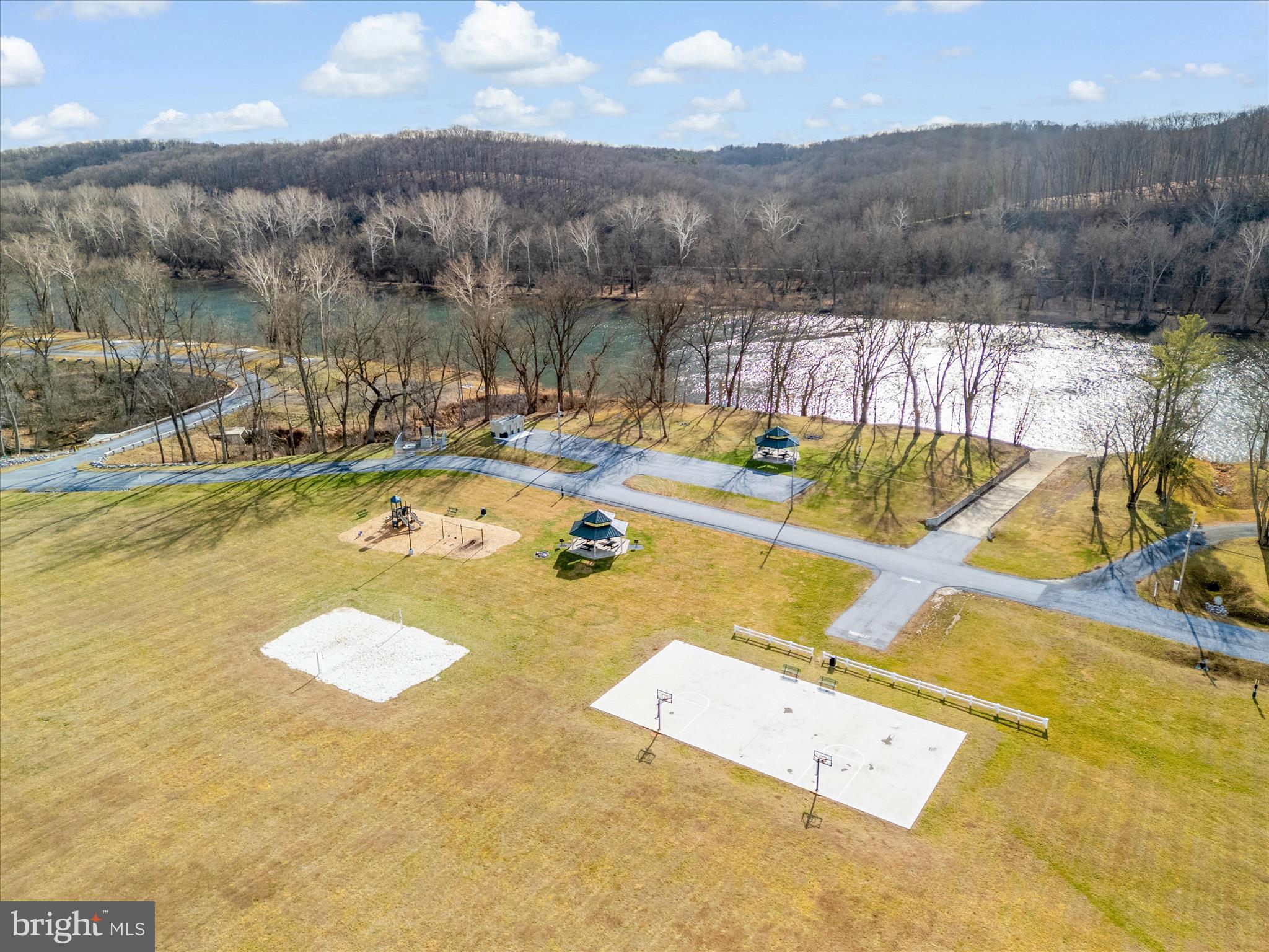 67 Lullwater Way Falling Waters, WV 25419 - Photo 52 of 56 a view of a swimming pool with a lake view