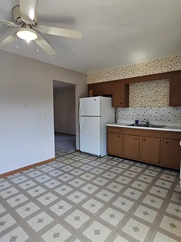 a room with a bed and a hallway