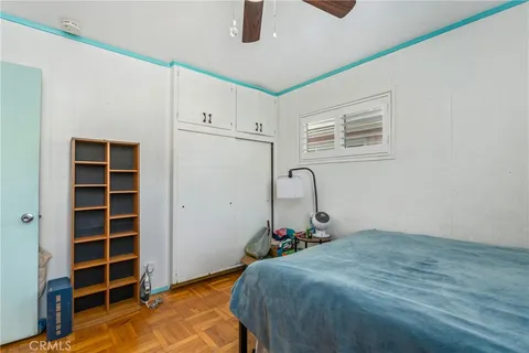 a bed room with a bed and a window