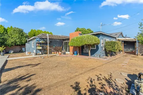 a front view of a house with a yard and a garage